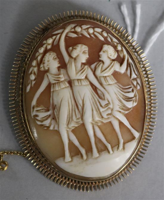 An Italian 9ct cameo brooch carved with the Three Graces, 59mm.